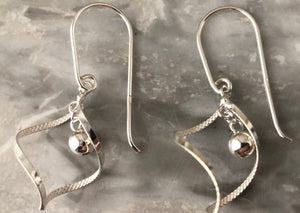 Sterling Silver Elegant Spiral with Hanging Ball Earrings Tiger Lily London